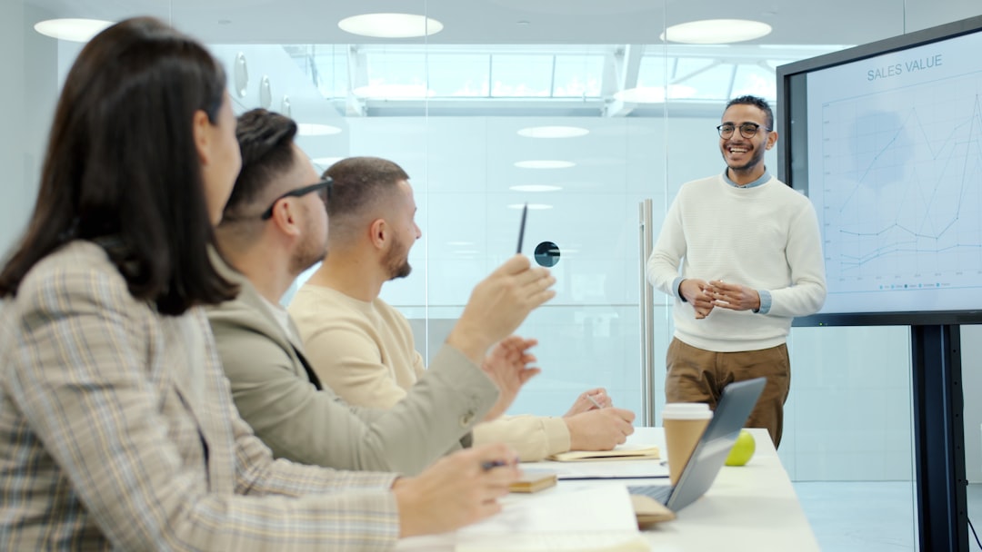 A leader presenting a technology transformation plan to colleagues in a modern office