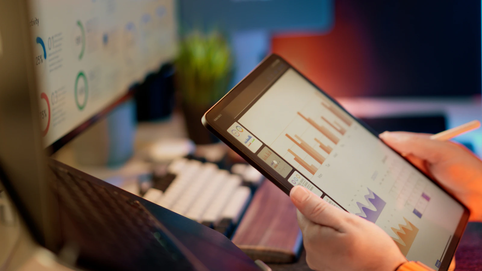 A professional analyzing business data on a laptop screen.