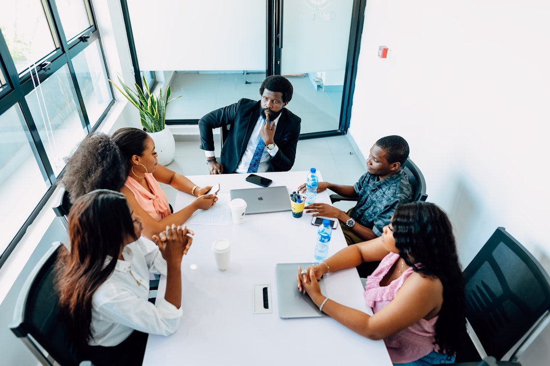 A team collaborating around a table during a technology transformation discussion